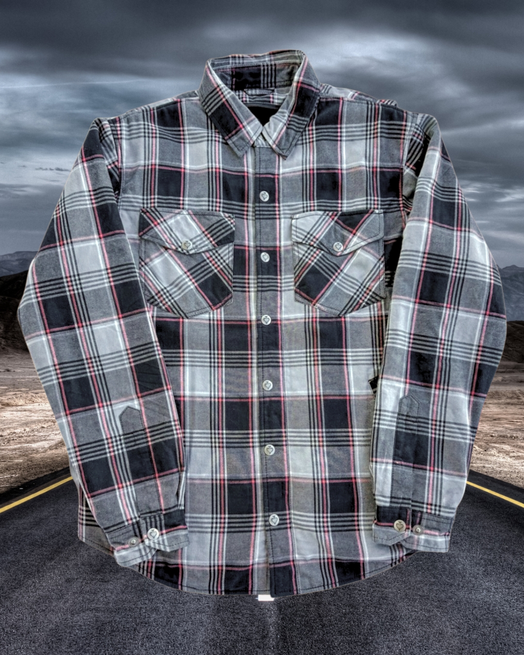 Plaid shirt with a dark, moody sky background
